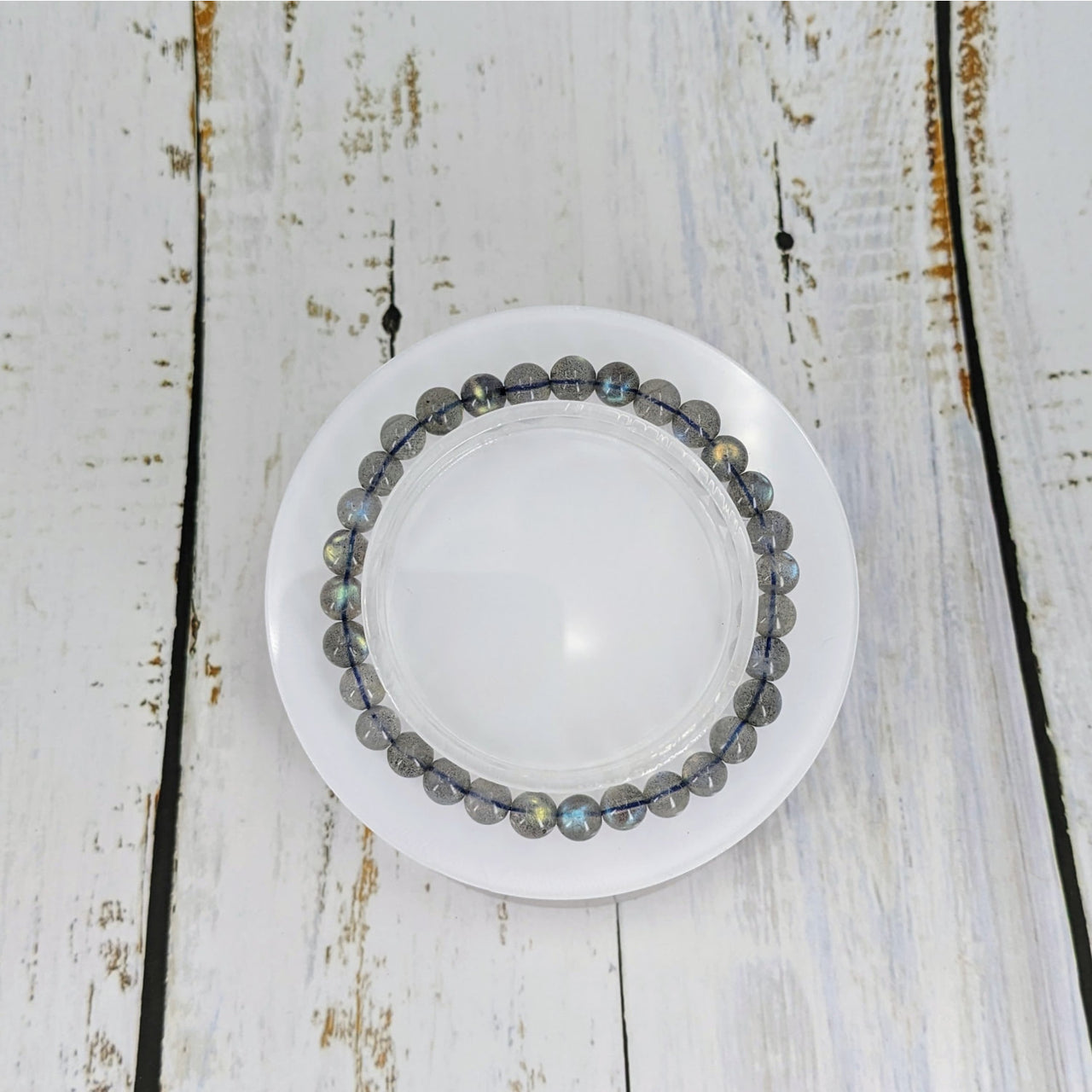 A white plate with a Labradorite 6-7mm beaded bracelet by Bliss Crystals