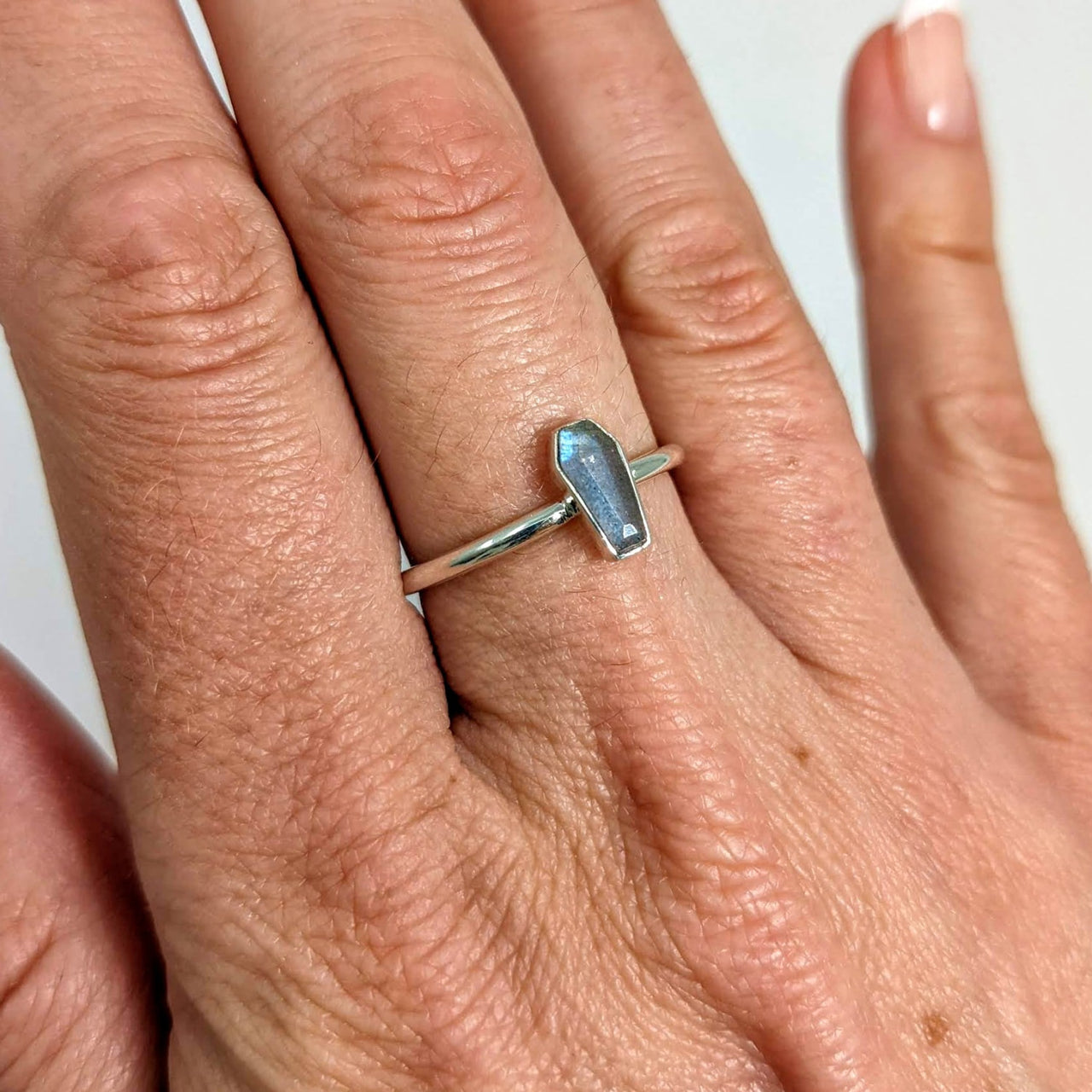 Woman’s hand wearing Labradorite Coffin Style, stackable sterling silver ring #SK6910