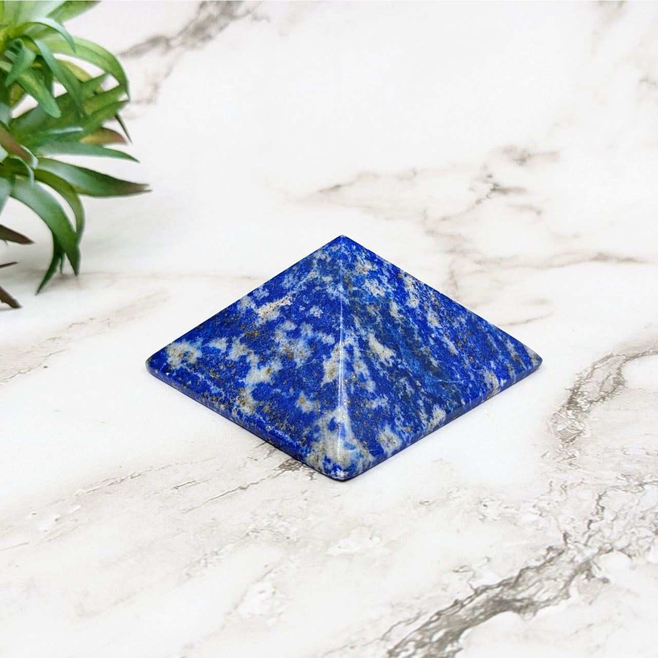 Lapis Lazuli 1.2’ Pyramid #LV5231 on a Marble Table – Enhance Your Space with Elegance