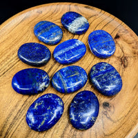 Thumbnail for Close-up of a wooden plate with blue palm stones from Lapis Lazuli collection #LV2718