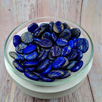 Thumbnail for A bowl of Lapis Lazuli 1’ palm stones, beautifully crafted and vibrant in blue