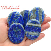 Thumbnail for Arafed image of a person holding beautiful lapis lazuli palm stones with pyrite