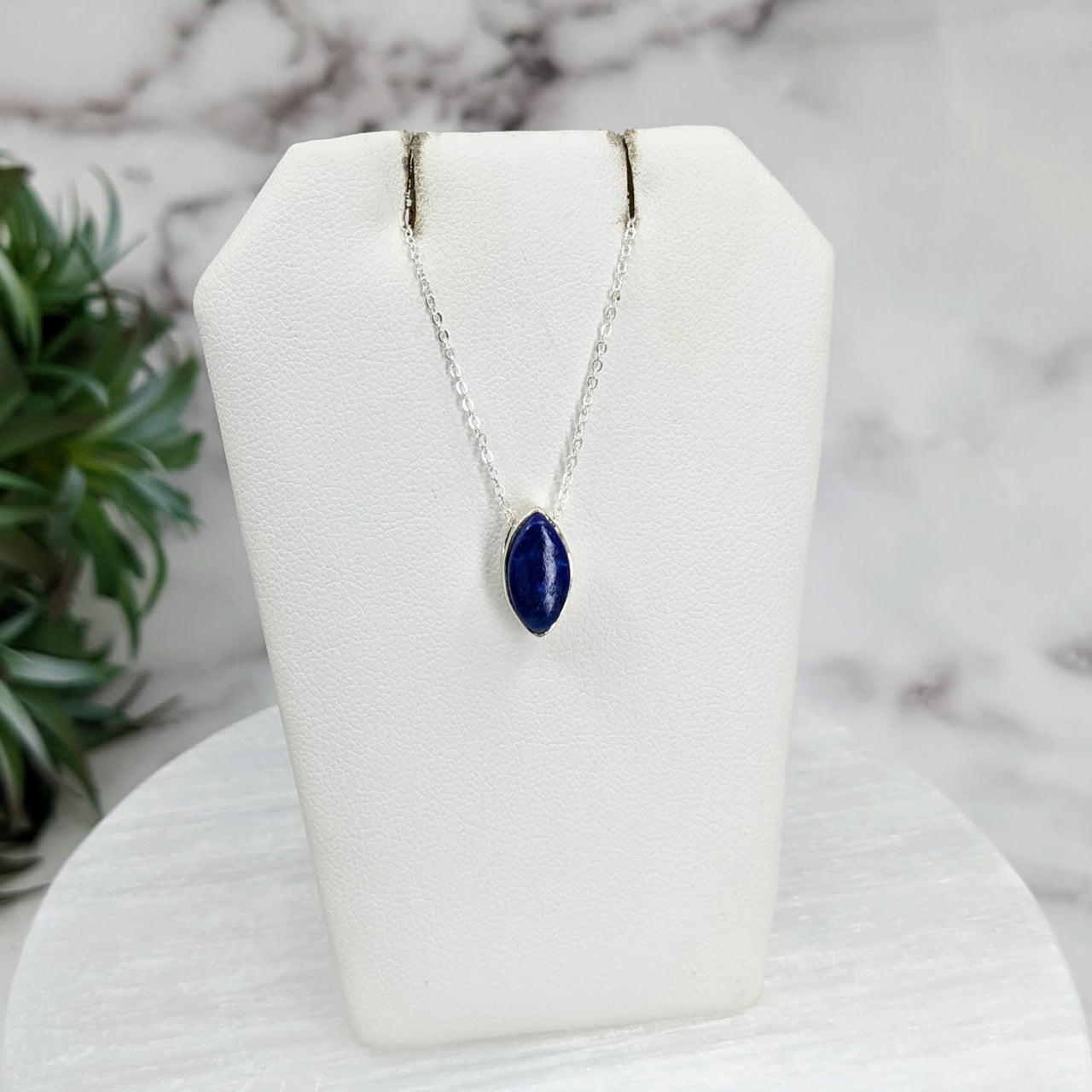 Lapis Lazuli Polished Necklace Sterling Silver Pendant on 18’ Chain displayed on white stand