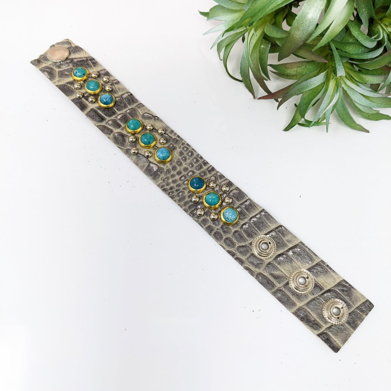 Turquoise and gold accented leather bracelet with adjustable studs