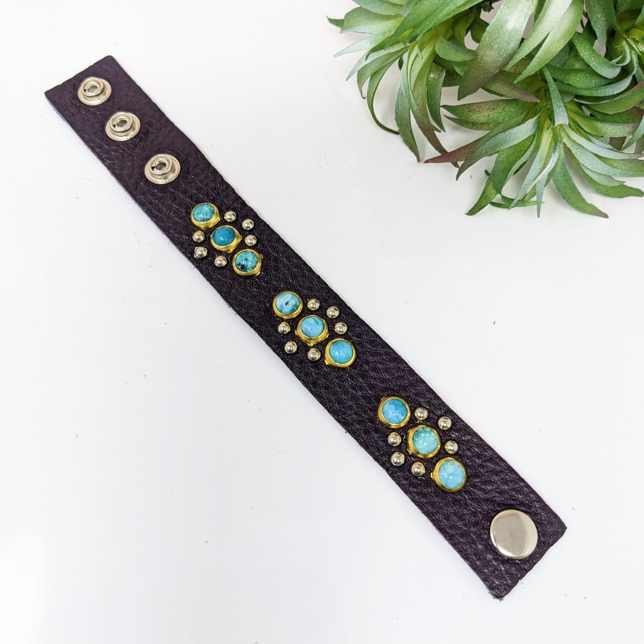 Leather bracelet with turquoise stones, gold accents, and adjustable studs - #LV2753