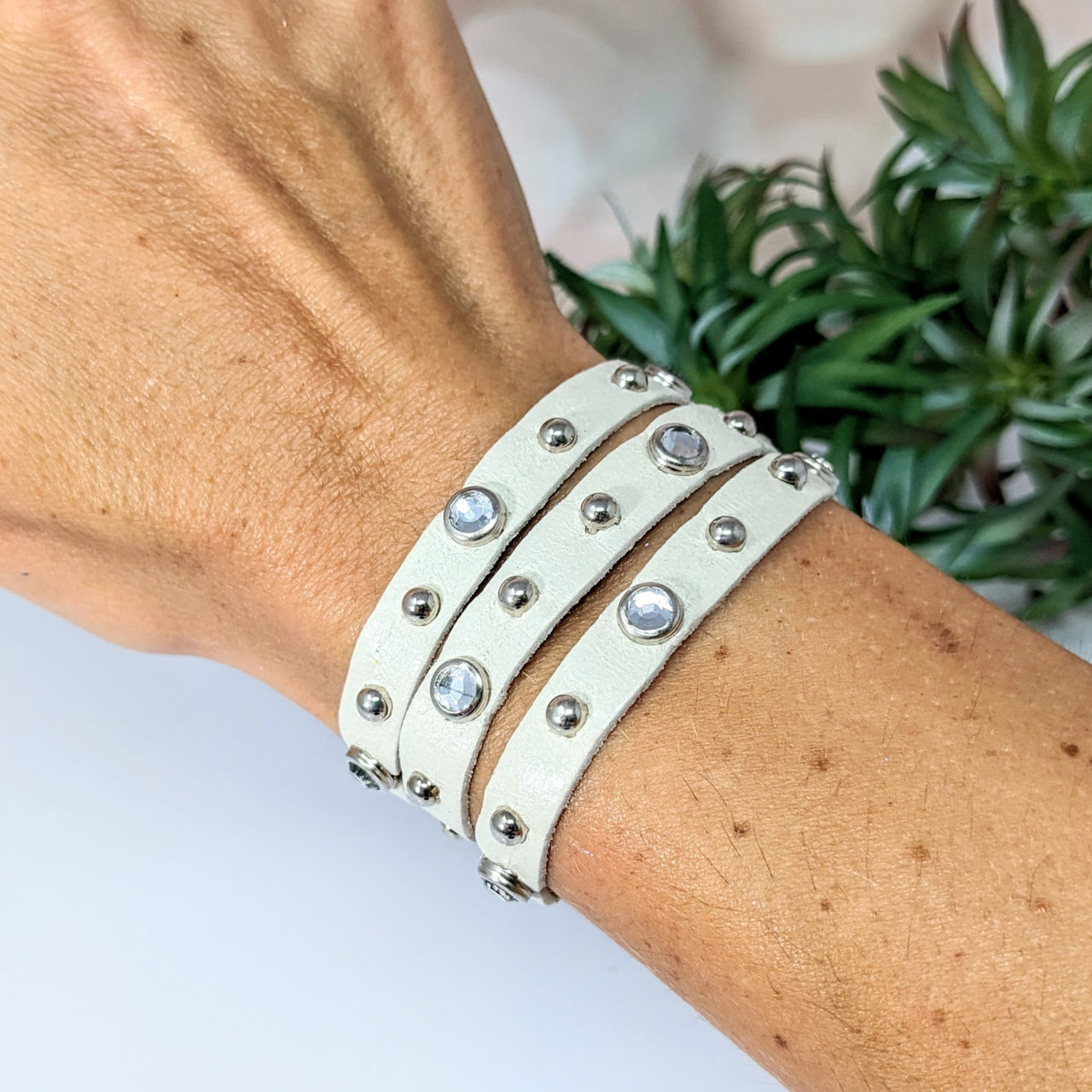 Elegant double wrap leather bracelet with rhinestones, adjustable for a perfect fit