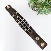 Thumbnail for Black leather guitar strap with silver buttons on display - Leather Bracelet #LV2752