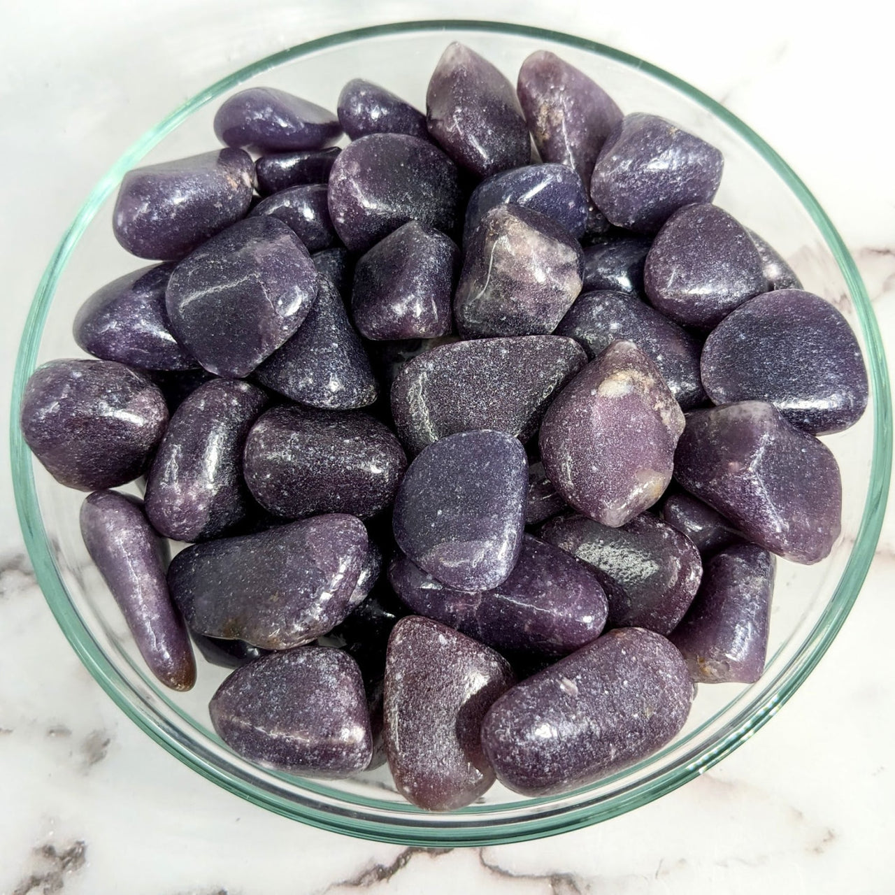 A bowl of Lepidolite tumbled stones in dark purple color #LV2020