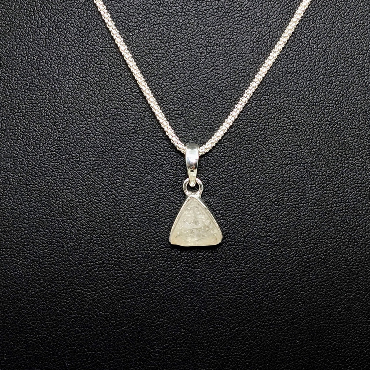 Libyan Desert Glass .4’ S.S. Triangle Pendant #LV4273 with a diamond pendant on a chain