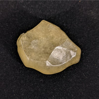 Thumbnail for Close-up of LIBYAN DESERT GLASS Rough #R215 with a small piece on it