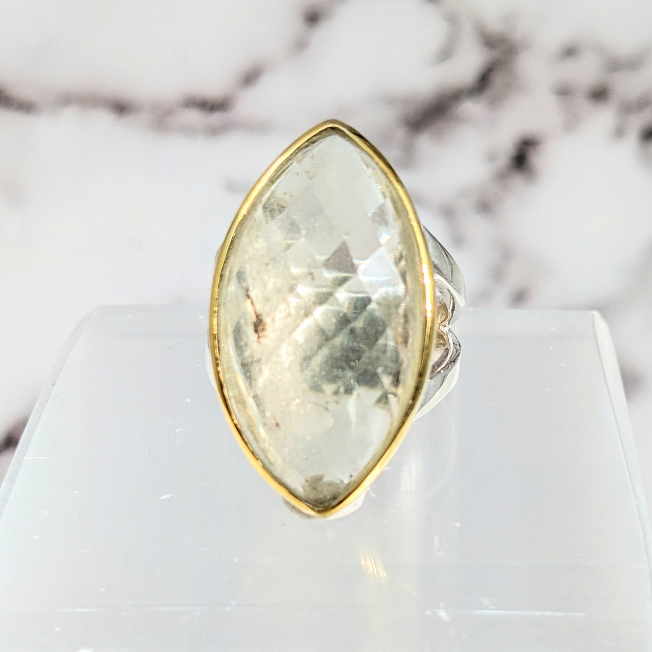 Libyan Desert Glass Sz 8 faceted marquis ring on white marble surface