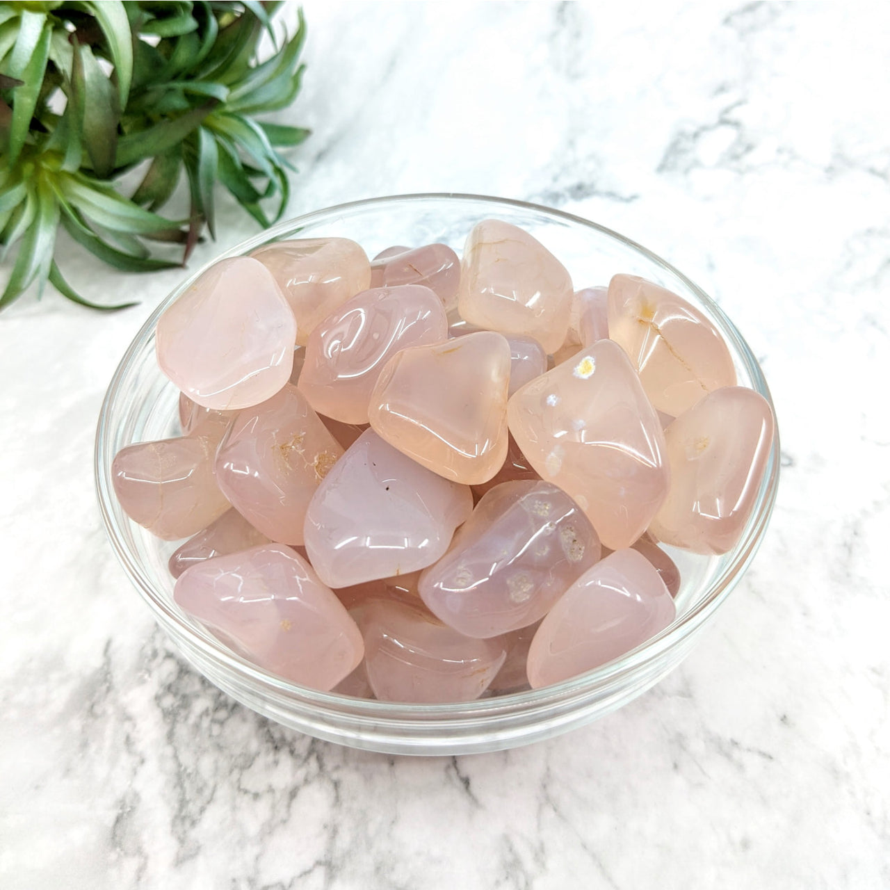 Bowl of Luna Rose Quartz A+ tumbled stones on marble counter #LV4975