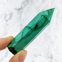 Thumbnail for Hand holding a green malachite stone from the Malachite 2.7 - 3.1’ Tower #LV1460 product line