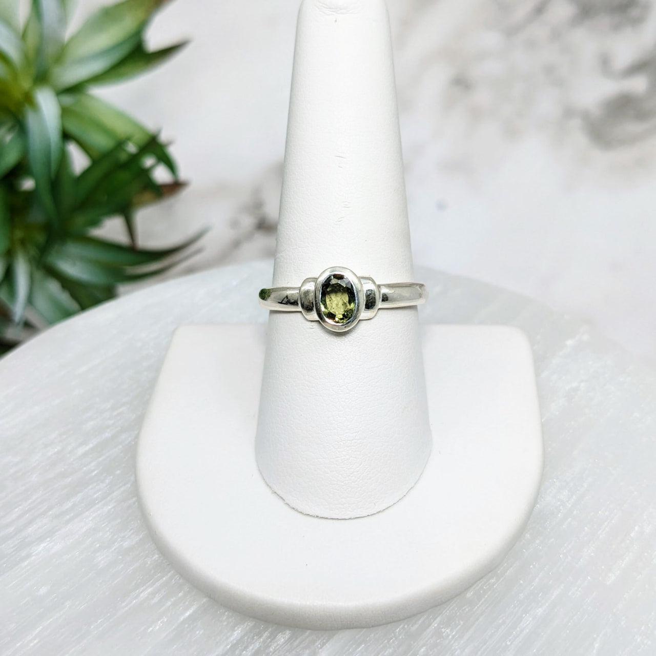 Moldavite S.S. Oval Faceted Ring #LV5028 with a green stone at its center