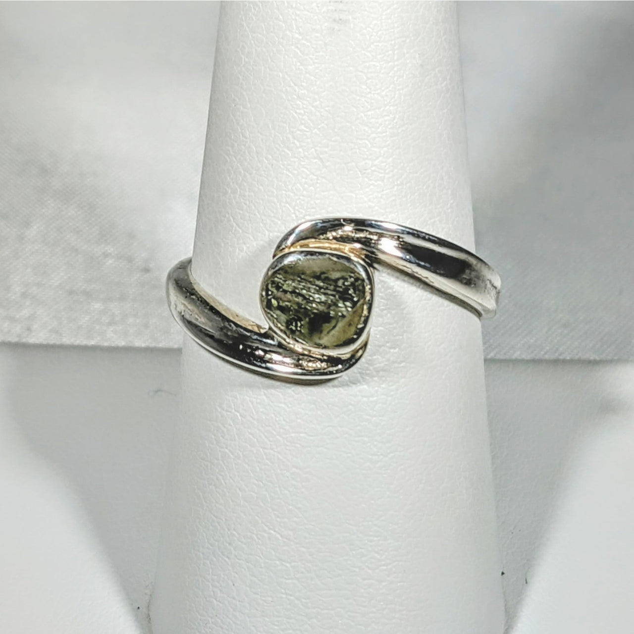 Moldavite Sterling Silver Swoop Ring #SK2626 featuring a vibrant green stone centerpiece