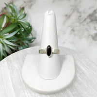 Thumbnail for Black diamond ring on a white marble pedestal - Moldavite Sz 10 Polished Oval Ring #LV5114