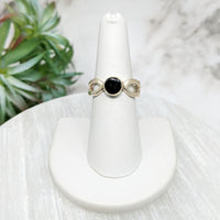 Thumbnail for Moldavite Sz 10 Polished Round Ring, black stone on white pedestal, model #LV5113