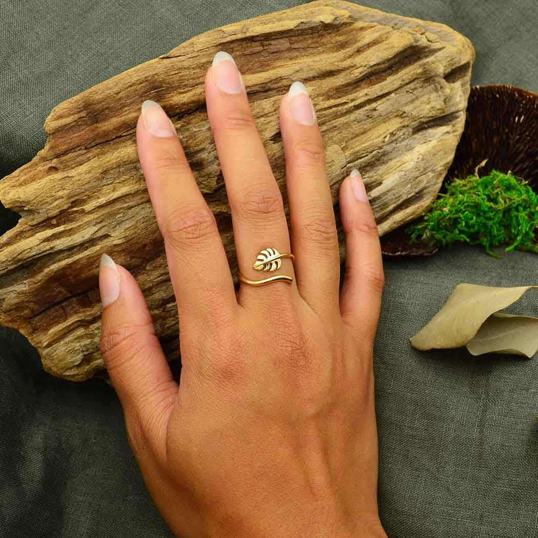 Monstera Leaf Adj. Bronze Ring #J017 on a woman’s hand with a gold ring