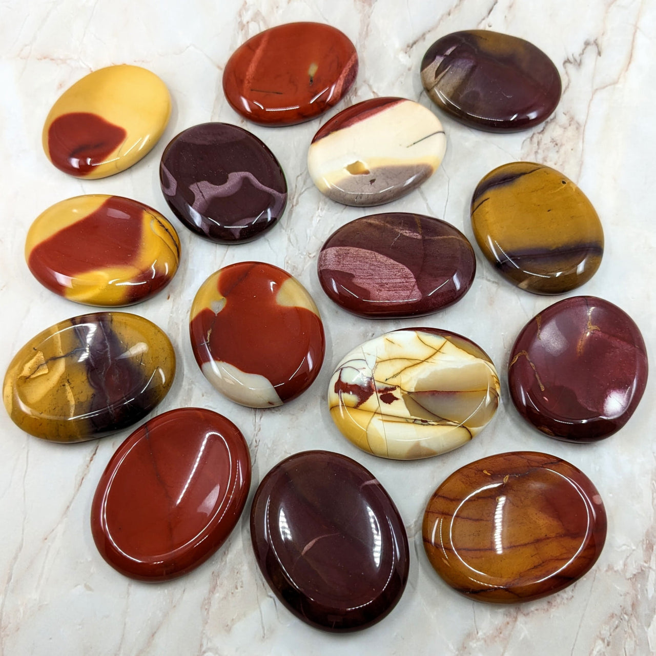 MOOKAITE Jasper Palm Stone AKA Polished Thumb Stones on Marble Surface #BC130