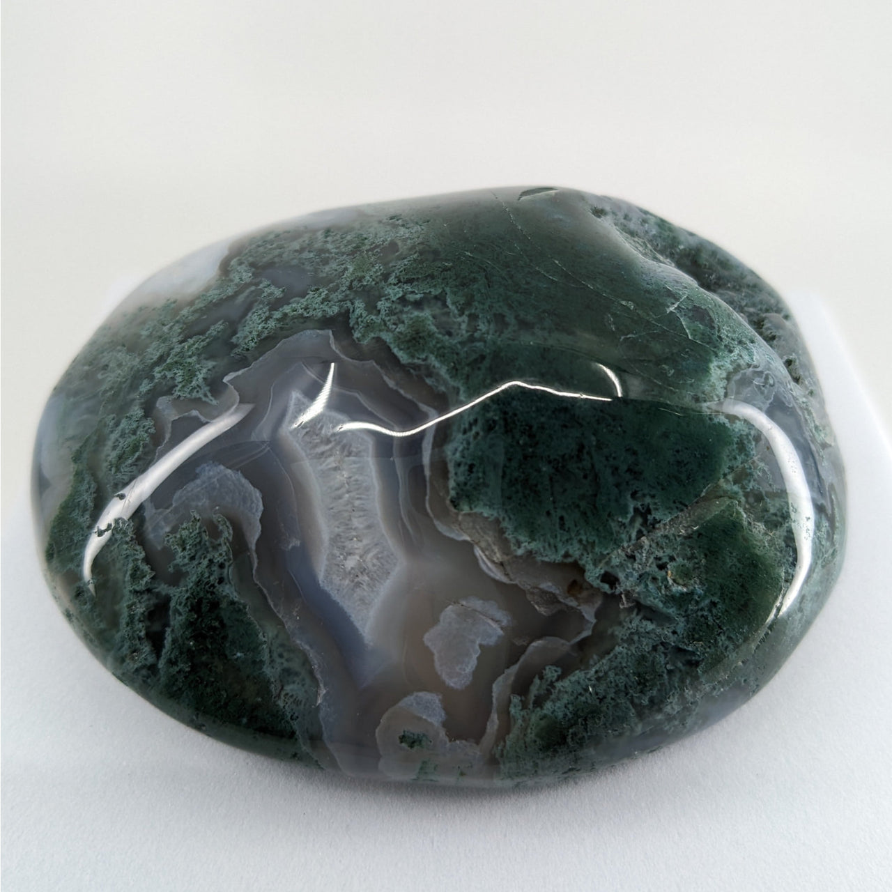 Moss Agate Touchstones #P165: Green and black stone on a white background