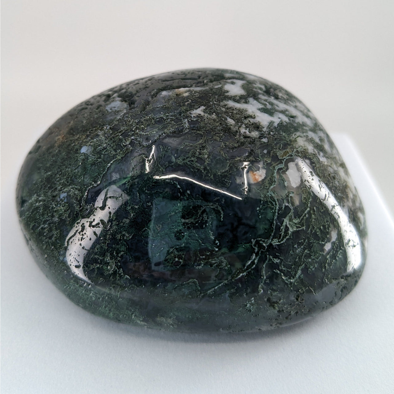 Moss Agate Touchstones #P165: Green and black stone on a white background