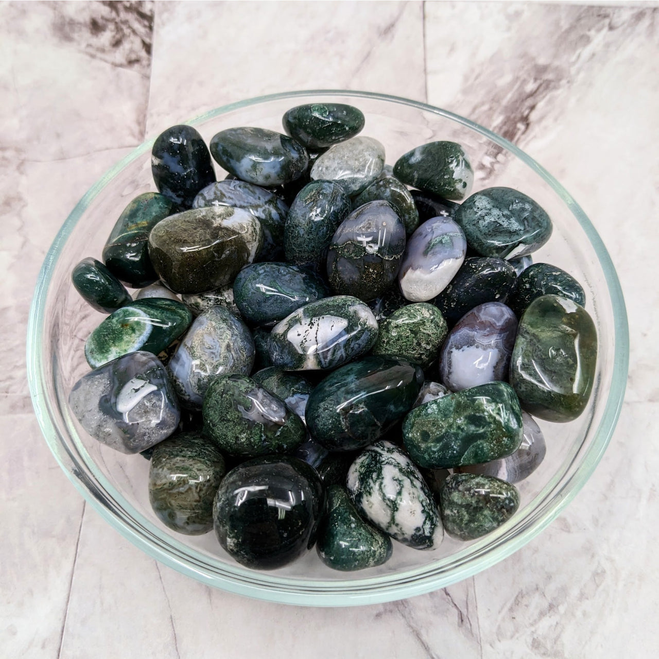 A bowl filled with Moss Agate tumbled stones (1.1’) for sale, product code #LV2294