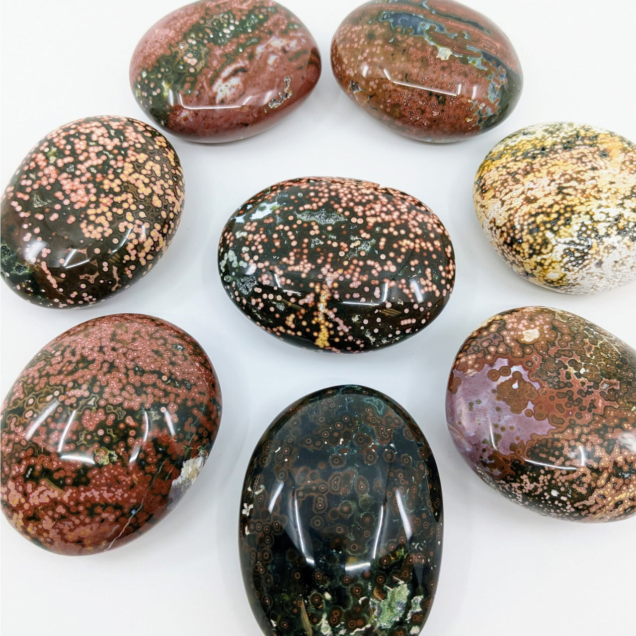 A selection of colorful Ocean Jasper Pebbles in product #LV3168 for sale