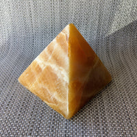 Thumbnail for Orange Calcite 4.3’ Pyramid #LV5430 - yellow stone pyramid on gray background