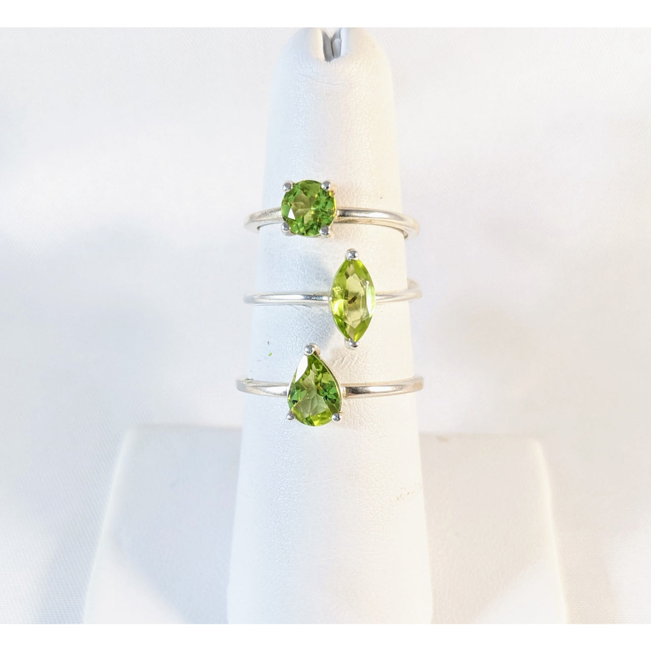 Sterling silver ring with two peridots, perfect for a stylish stackable look. #J937