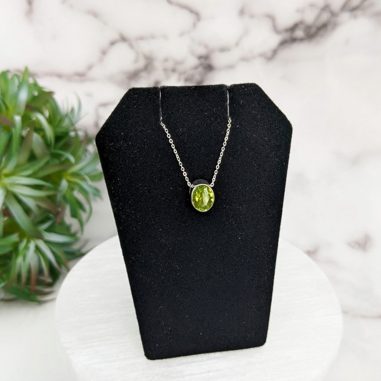 Peridot faceted necklace in sterling silver with green stone pendant on 18-inch chain