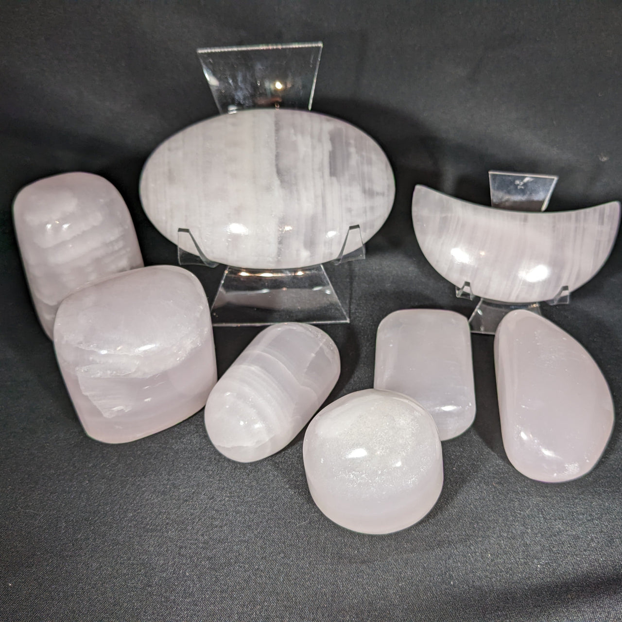 White quartz crystals displayed with Pink Calcite Freeform, Pebble, and Crescent Moon #M182