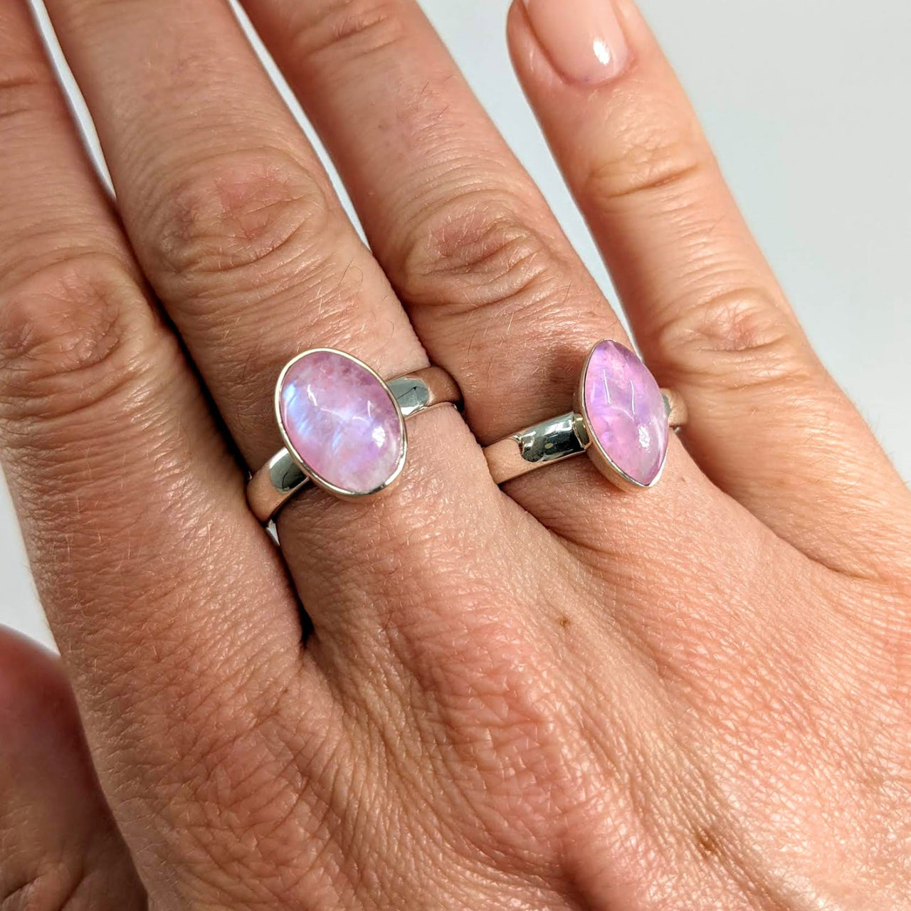 Woman’s hand wearing Pink Moonstone Sterling Silver Rings from product #SK7301