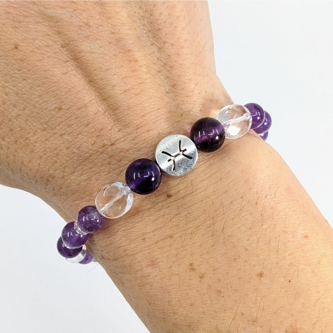 Woman’s hand wearing Pisces Zodiac Handmade Beaded Bracelet 7’ Astrology Sign Jewelry