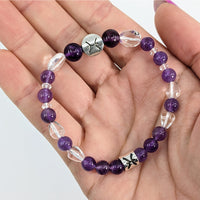 Thumbnail for A person holding a Pisces Zodiac Handmade Beaded Bracelet with silver cross