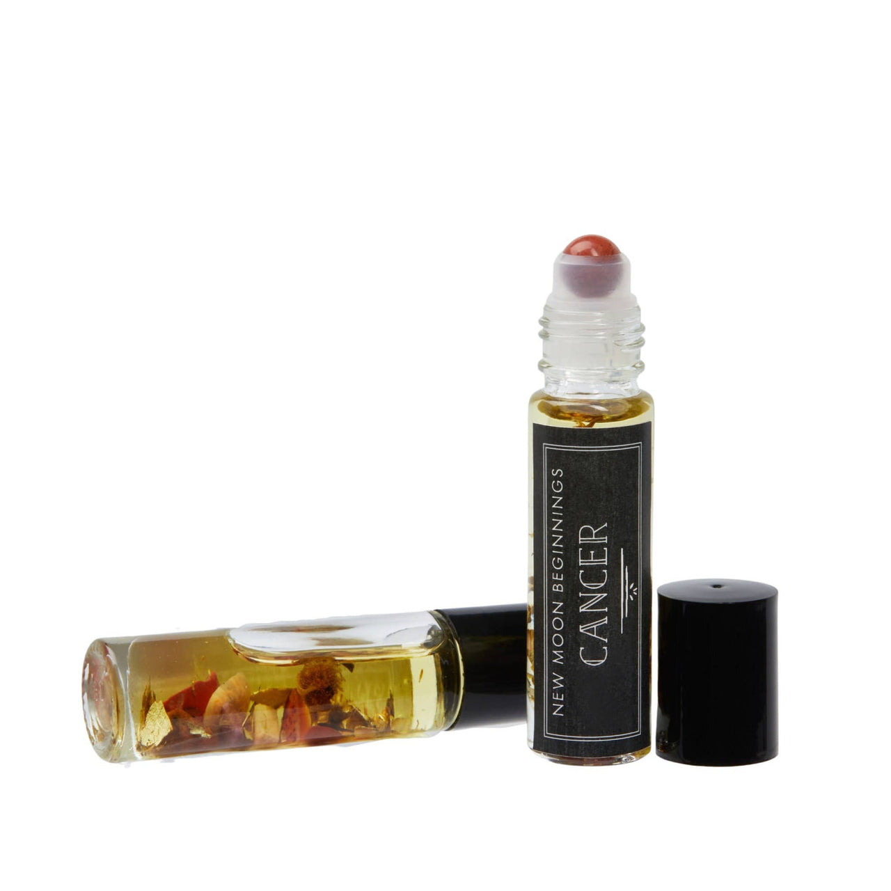 A close-up of Positive Energy Intention Roll-On perfume with organic jojoba oil and essential oils