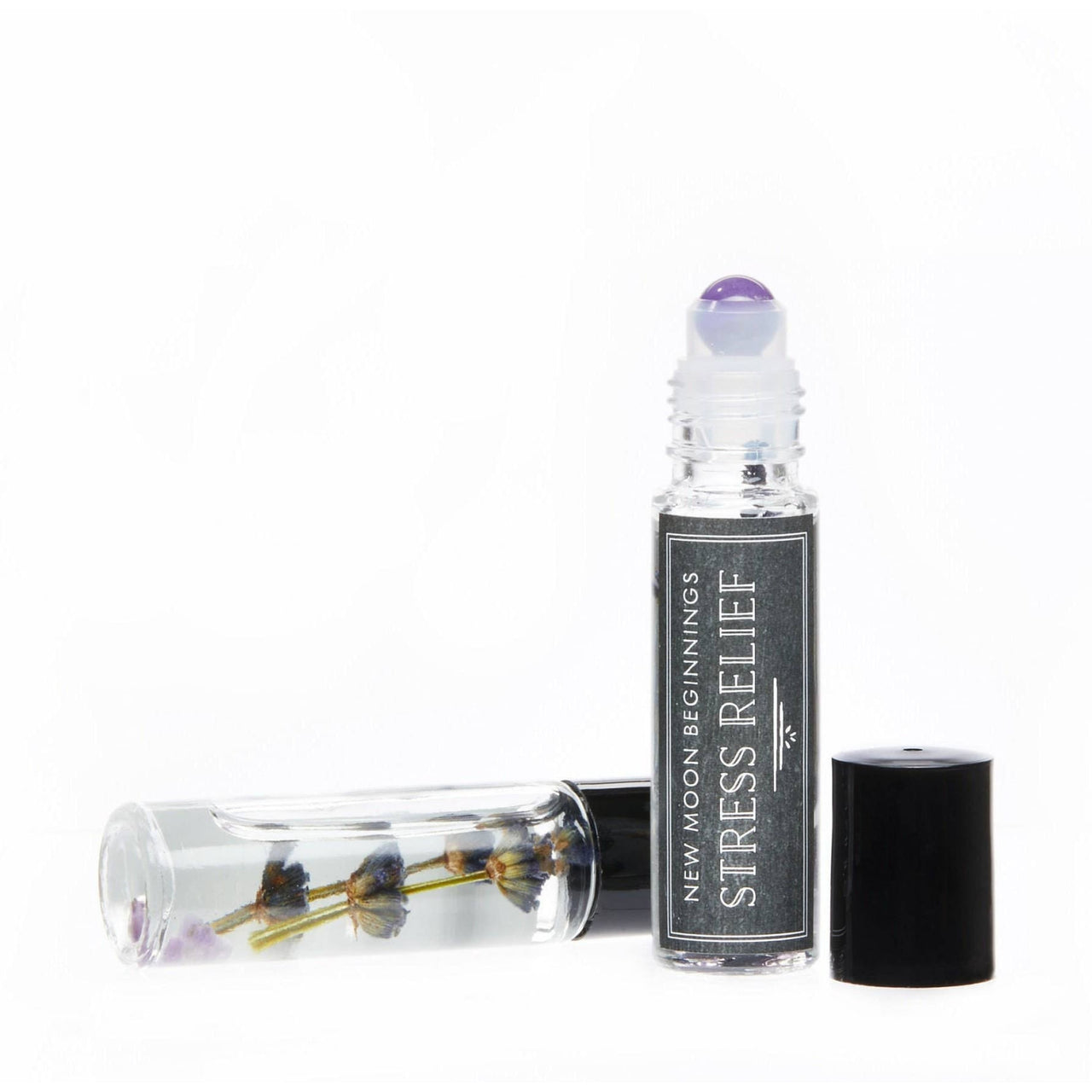 Essential oil roll-on with organic jojoba oil base and positive energy crystal