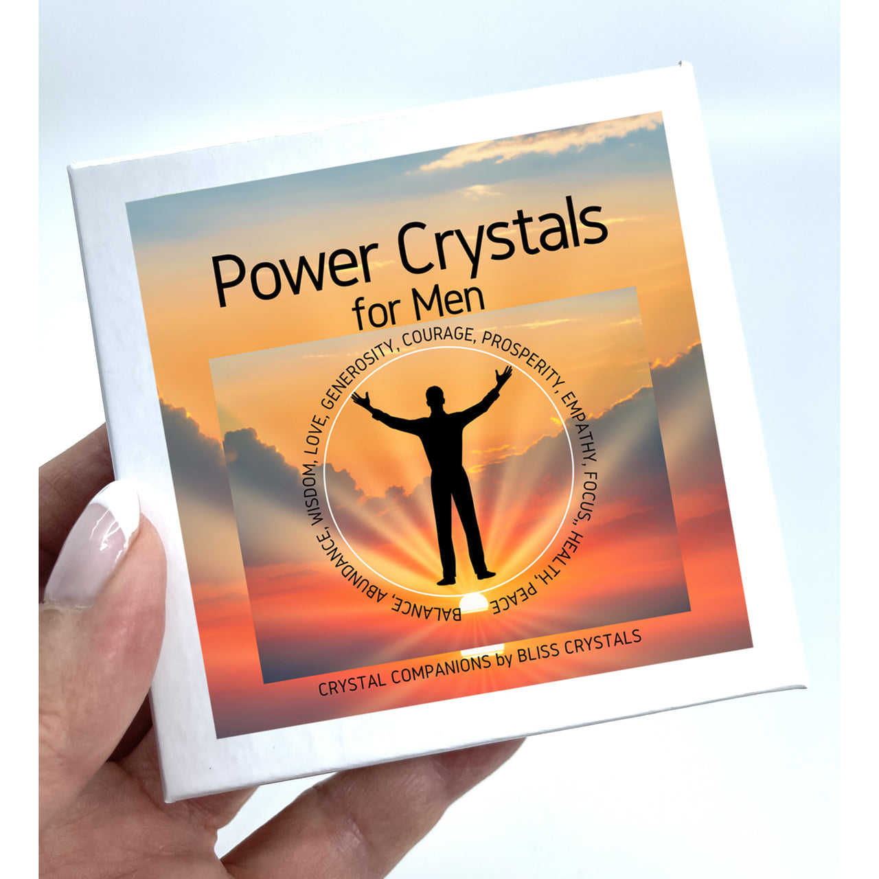 A person holding a book showcasing the ’Power Crystals for Men Set of 8 Tumbled Stones #K207’