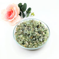 Thumbnail for A bowl of green crystals beside a rose - Prehnite and Epidot Gravel Mini Chips 28g Parcel