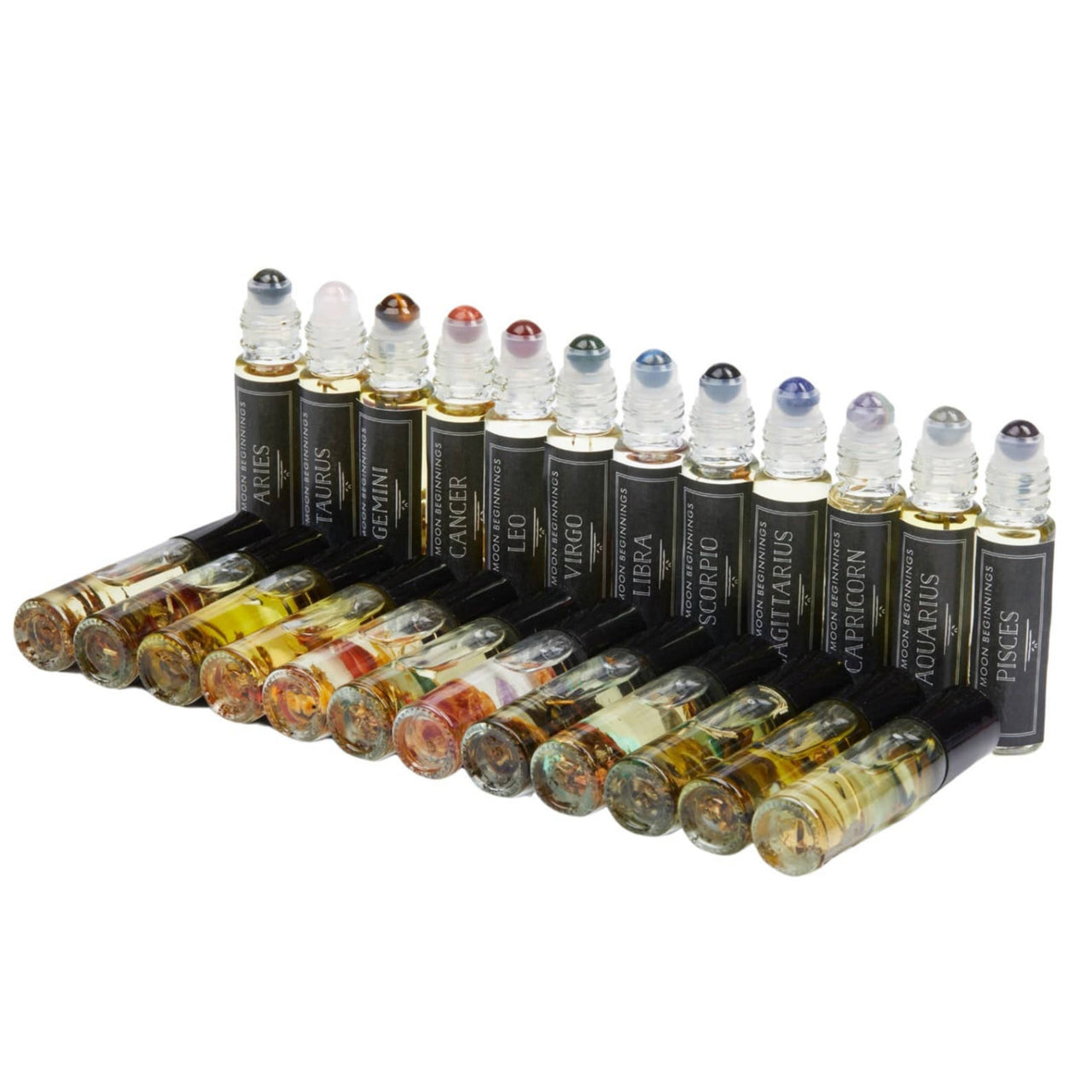 Group of crystal-infused essential oils with organic jojoba oil base in 10ml roll-on bottles