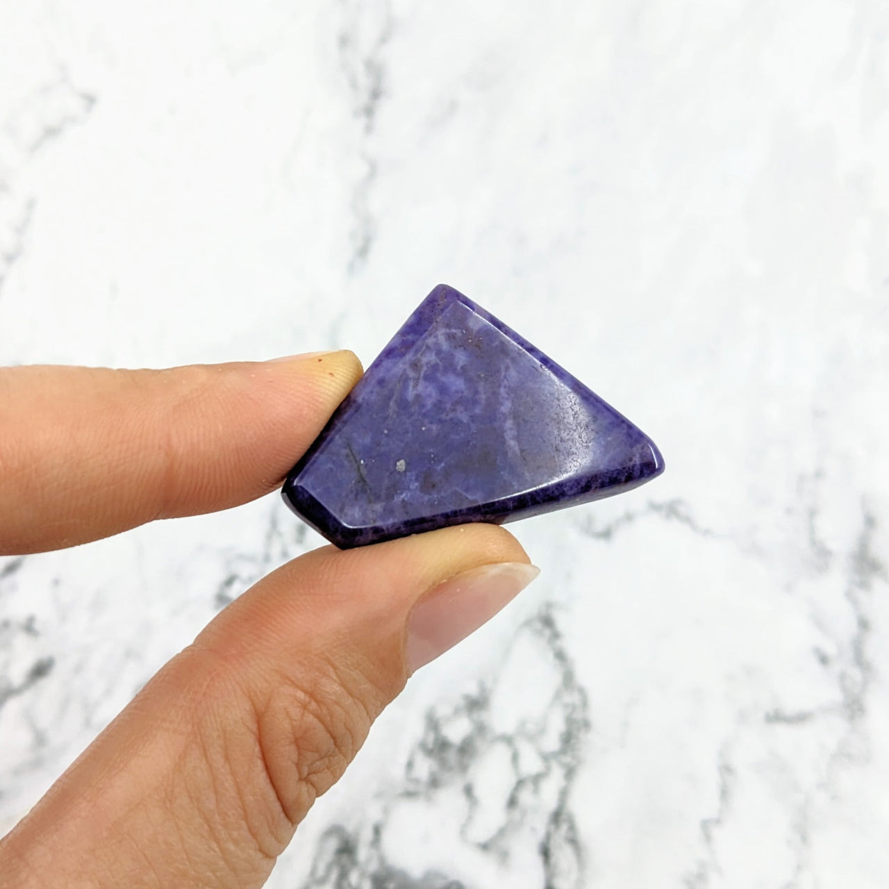 Hand displaying Purple Jade Grade AA Polished Slice #LV2021, flat shape, vibrant purple stone