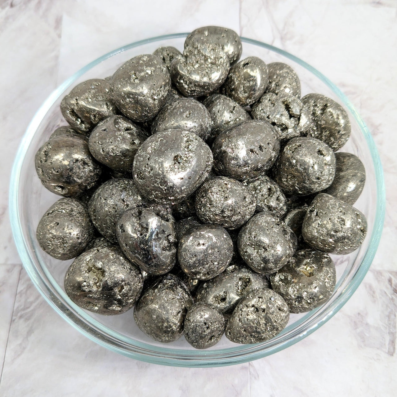 Silver foiled chocolates in a bowl displayed with Pyrite Round Tumble Stone #LV2260