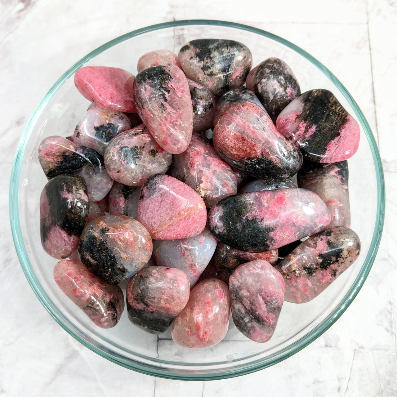 A bowl of Rhodonite in Quartz tumbled stones (1-1.5’) #LV2250, pink and black rocks