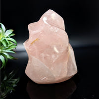 Thumbnail for Rose Quartz 4.3’ Flame #LV4743 with a pink quartz stone and plant background