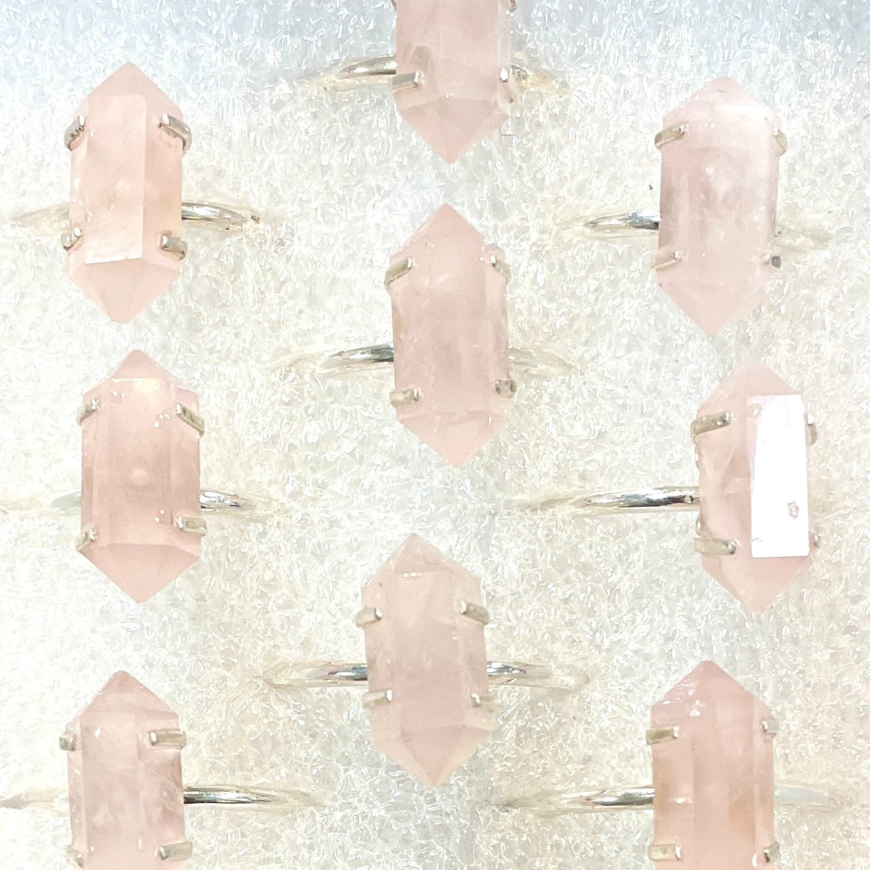 Rose Quartz double terminated points with sterling silver ring #SKU6904 on a white background