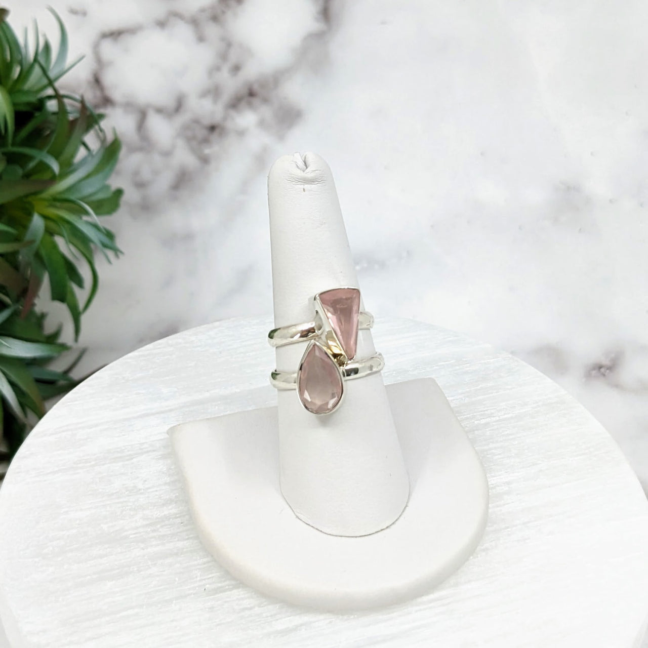 Rose Quartz Faceted Sterling Silver Ring on White Stand with Plant Background - Size 6-8 #LV3217