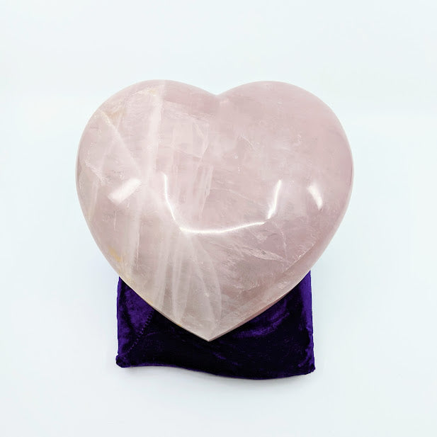 Rose Quartz Polished Heart 6.1 Kg #H007 displayed on a luxe purple velvet pillow