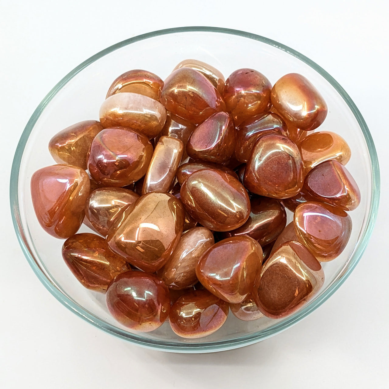 A bowl of Rose Quartz and Pink Brown Tumbled Stones from the collection #LV1860