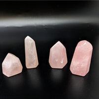 Thumbnail for Rose quartz tower collection featuring three pink quartz points on a sleek black surface