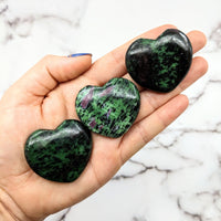 Thumbnail for Ruby Zoisite 1.7’ Polished Heart #LV1817: Two green and black marble hearts on a hand