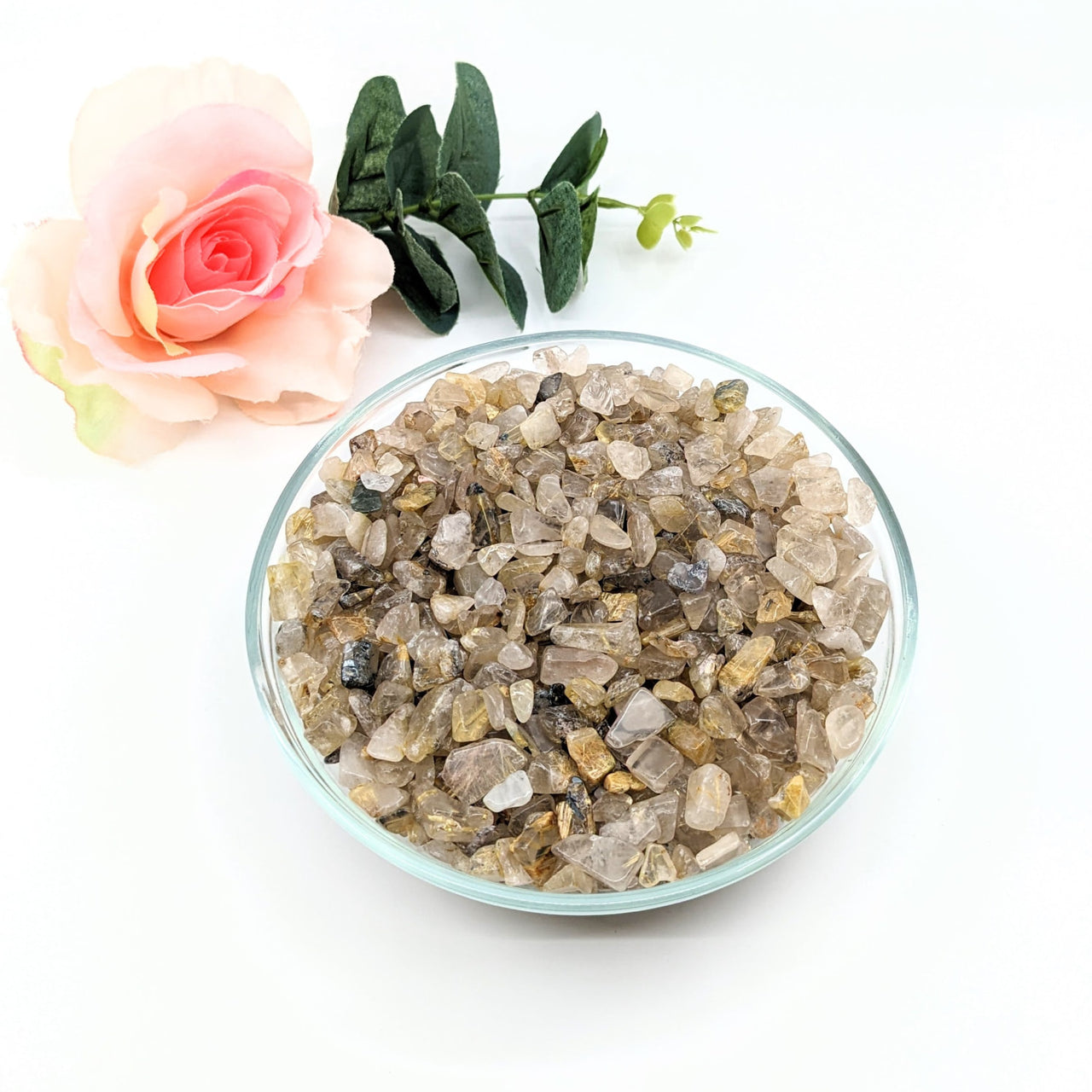 Bowl of rutilated quartz crystals and a rose from Rutilated Quartz Gravel Mini Chips #LV3074